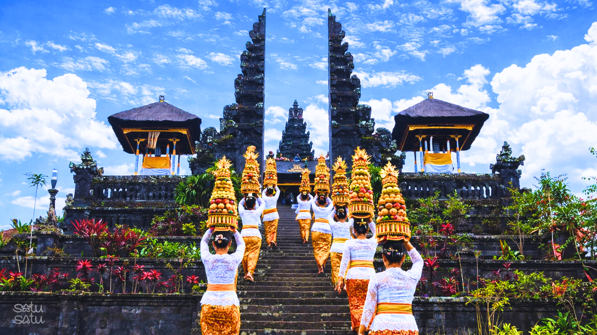 Balinese women carrying traditional offerings walking up the stairs of Pura Besakih, Bali’s Mother Temple