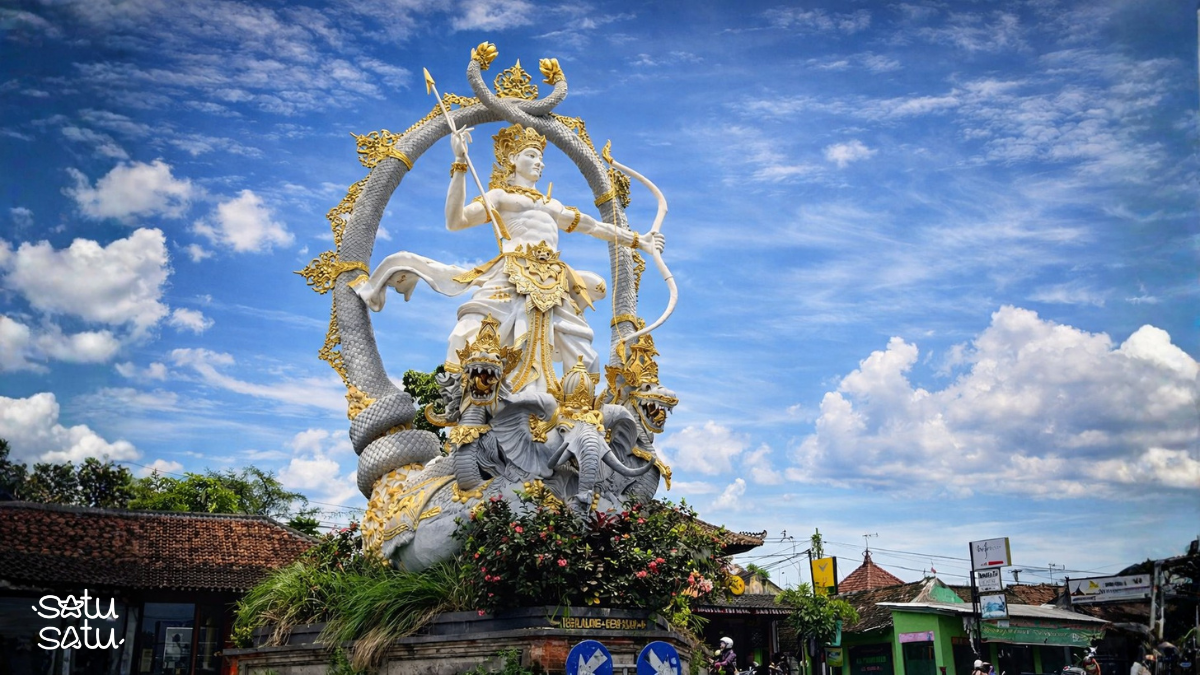 Arjuna statue in Ubud, Bali, depicting the legendary archer from Hindu mythology with ornate golden details and traditional Balinese design.