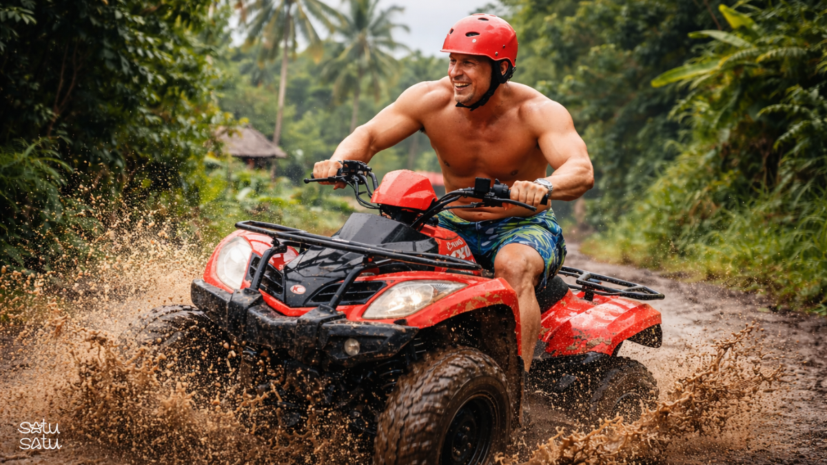 Traveler riding an ATV through muddy jungle trails in Ubud, Bali
