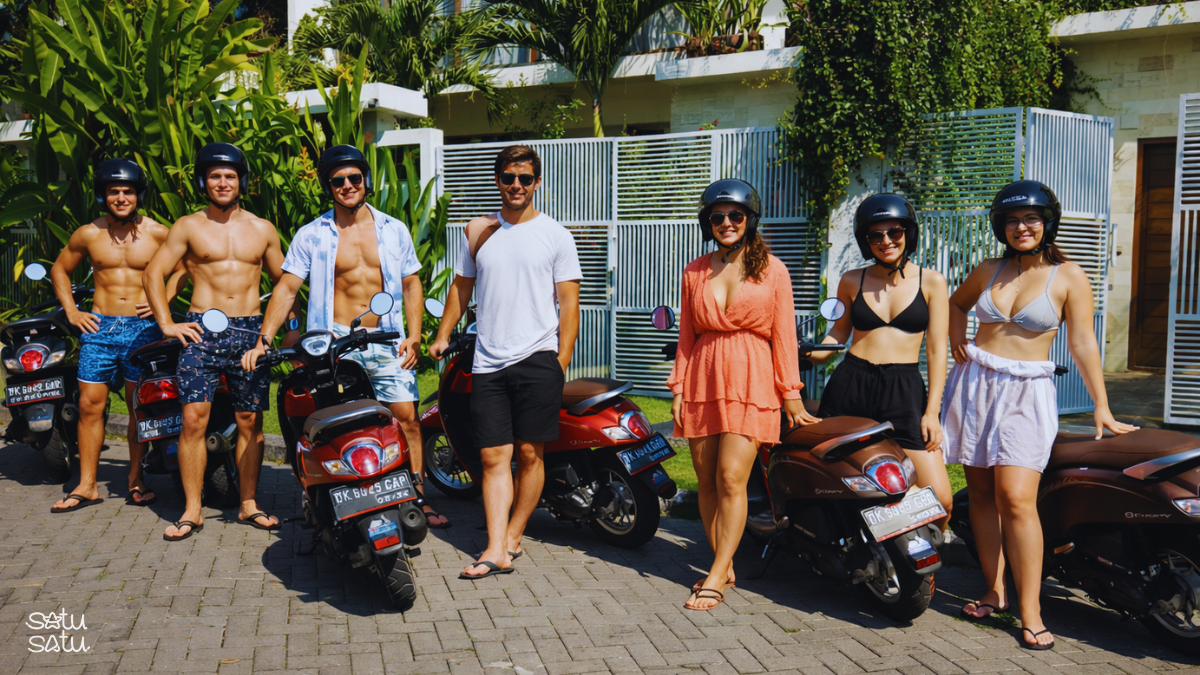 Group of travelers with rental scooters preparing for a motorbike tour in Bali