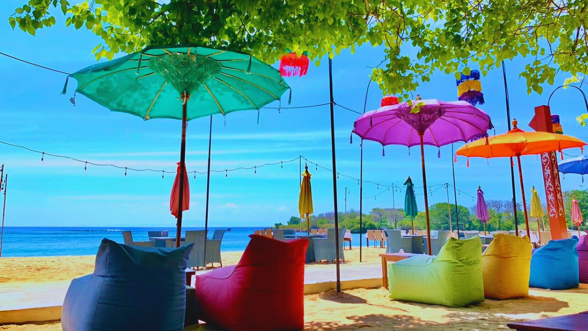 Colorful beachfront seating area at Kekeb Restaurant in Nusa Dua Bali overlooking the ocean