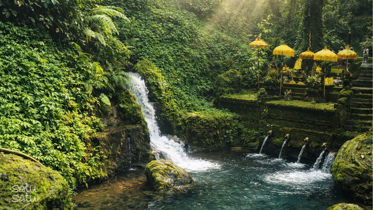 Pura Mengening in Bali, a sacred melukat purification site with natural spring water, lush jungle surroundings, and traditional stone water spouts.